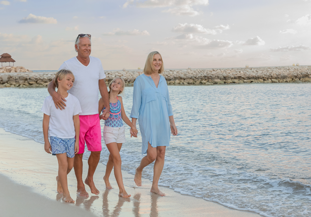 Family walking at the beach Family walking at the beach